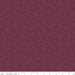 A close-up of a repeating floral pattern in deep burgundy and muted mauve, with a ruler strip along the bottom showing scale.