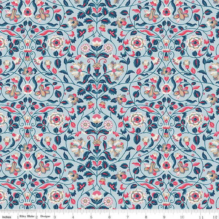 Floral patterned fabric with a ruler at the bottom for scale.
