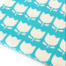 Fabric with white tulip pattern on a turquoise background