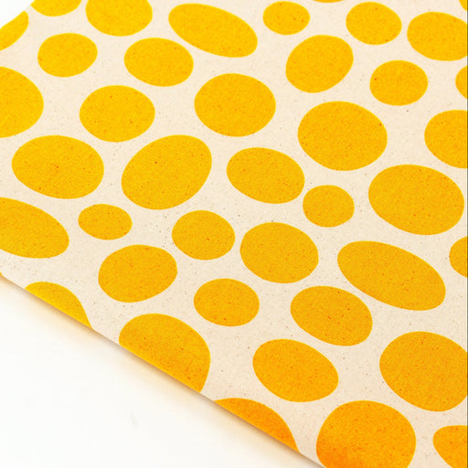 Close-up of yellow polka dot fabric 