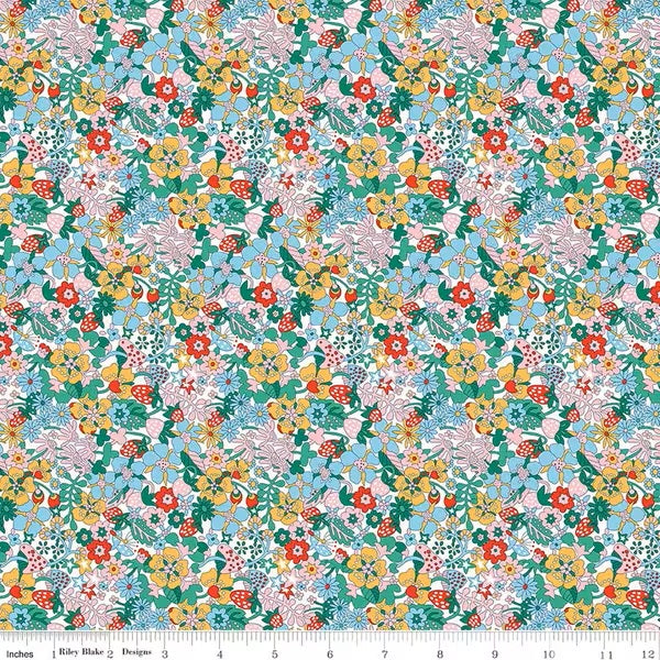 Colorful floral pattern fabric with a ruler at the bottom for scale.