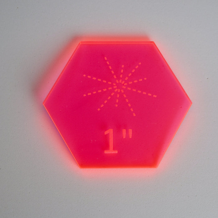 Hexagonal red laser measurement gauge on a white background