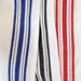 Close-up of fabric with blue, black, and red stripes on a white background