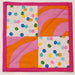 Colorful quilt block with geometric patterns on a white background