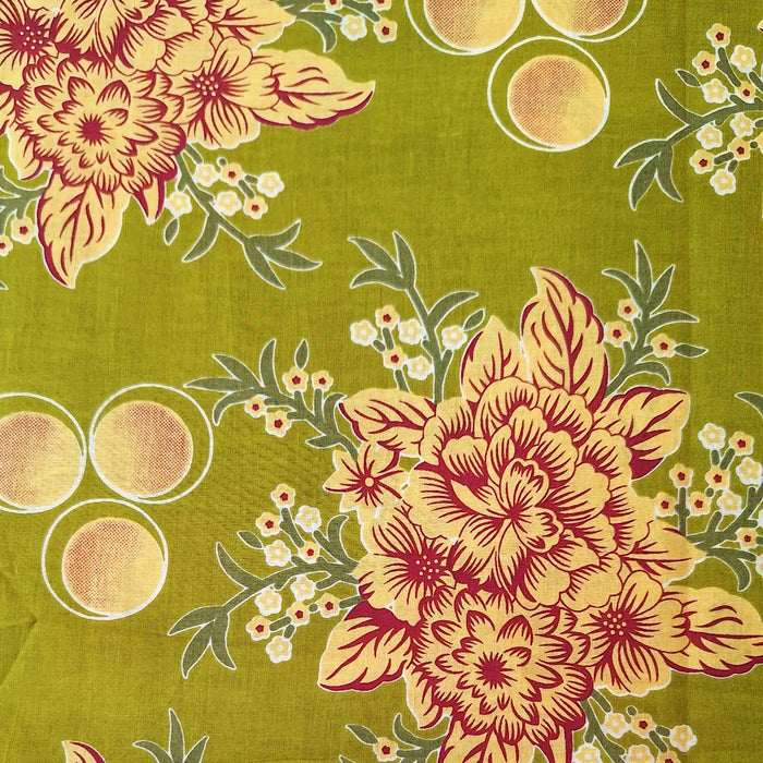 Floral pattern with red and yellow flowers on a green background