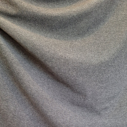close up of draped dark grey fabric
