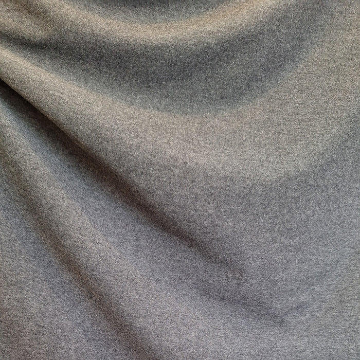 close up of draped dark grey fabric
