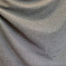 close up of draped dark grey fabric
