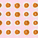 Pattern of orange sun illustrations with faces on a pink background