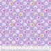 Floral patterned fabric with a ruler at the bottom for scale on a purple background