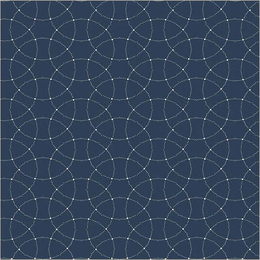 A close-up of a fabric or material swatch with a repeating geometric pattern of white dotted circular arcs over a dark navy blue background.
