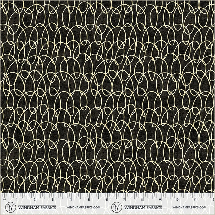 Fabric with a geometric pattern on a black background, featuring Windham Fabrics branding.