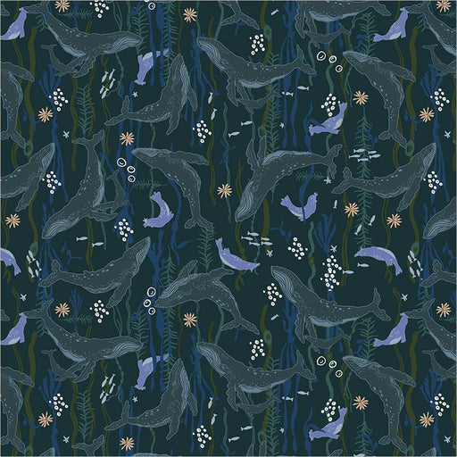 fabric closeup of whales and seals on dark teal background swimming amongst sea plants