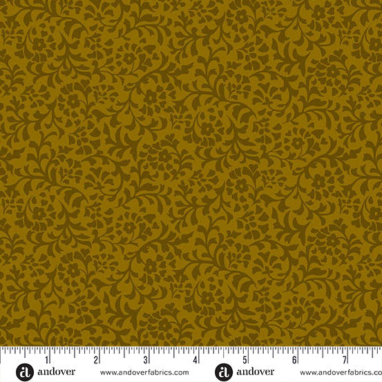 Dark green floral patterned fabric with a ruler at the bottom for scale.