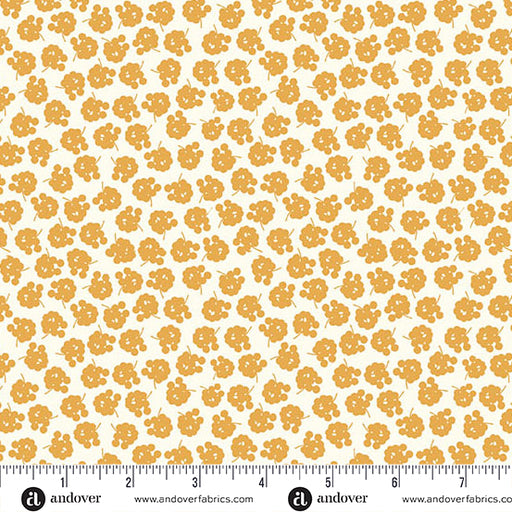 Patterned fabric with yellow flowers on a white background, featuring Andover Fabrics branding.