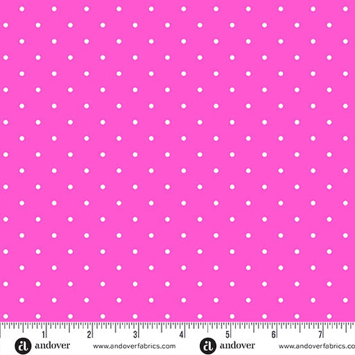polka dot fabric with white dots on hot pink background and a measuring tape at the bottom