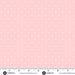 pale pink polka dot fabric with a measuring tape at the bottom