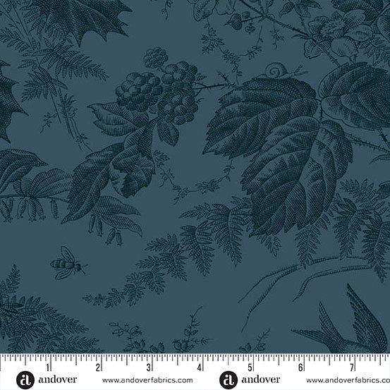 Green fabric with nature-themed pattern featuring leaves, berries, and a bee, with a ruler at the bottom for scale.
