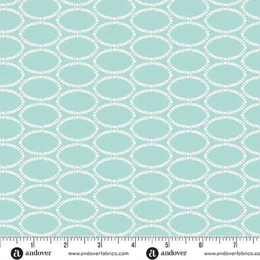 Teal fabric with white geometric pattern and Andover Fabrics label