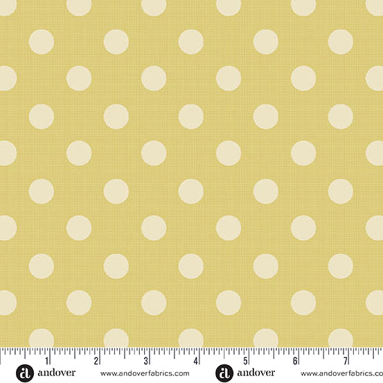 Fabric with white polka dots on a yellow background, featuring Andover Fabrics branding.