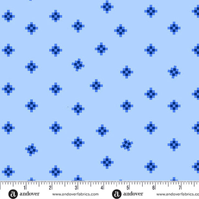 Blue fabric pattern with a ruler at the bottom for scale, featuring the brand 'Andover'.