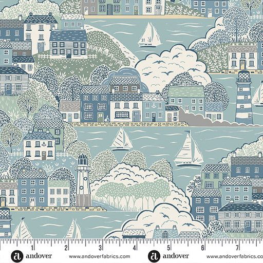 Fabric pattern with a coastal scene featuring houses, trees, and sailboats, with a ruler at the bottom.