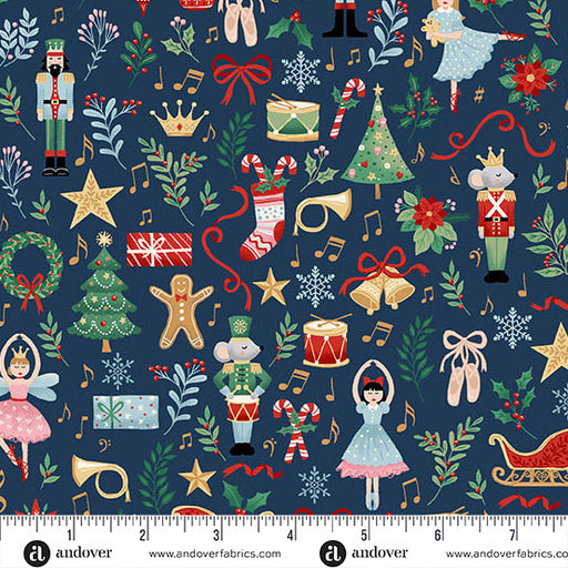 close up of Christmas fabric with nutcrackers, fairies, gingerbread men, toy drums, Christmas trees and bells on a navy background