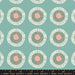 Patterned fabric with circular designs on a teal background, featuring Ruby Star Society label.