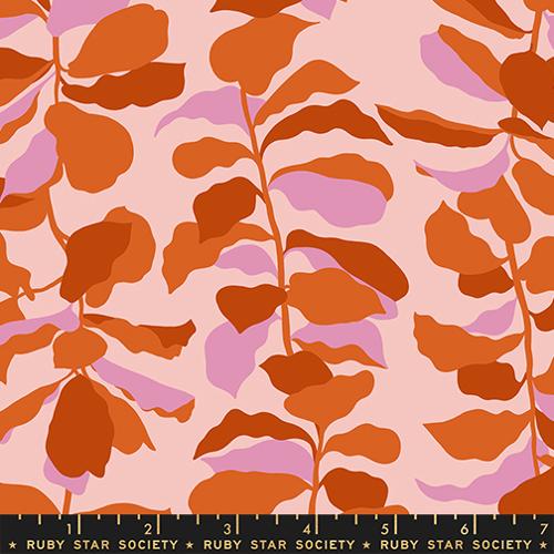Fabric with orange and pink leaf pattern on a pink background, featuring Ruby Star Society label.