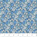 Floral fabric pattern with blue and white flowers on a blue background