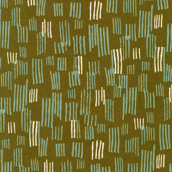 Patterned fabric with green and beige design on a green background