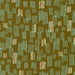 Patterned fabric with green and beige design on a green background