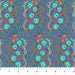 Patterned fabric with peacock designs on a blue background