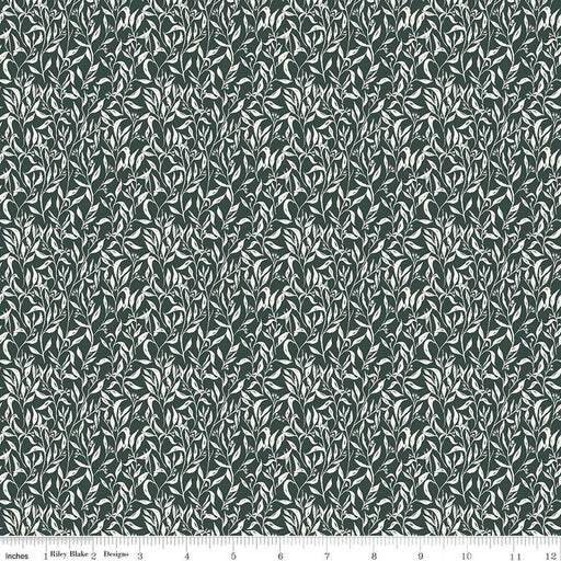 Patterned fabric with small leaf design on a dark green background