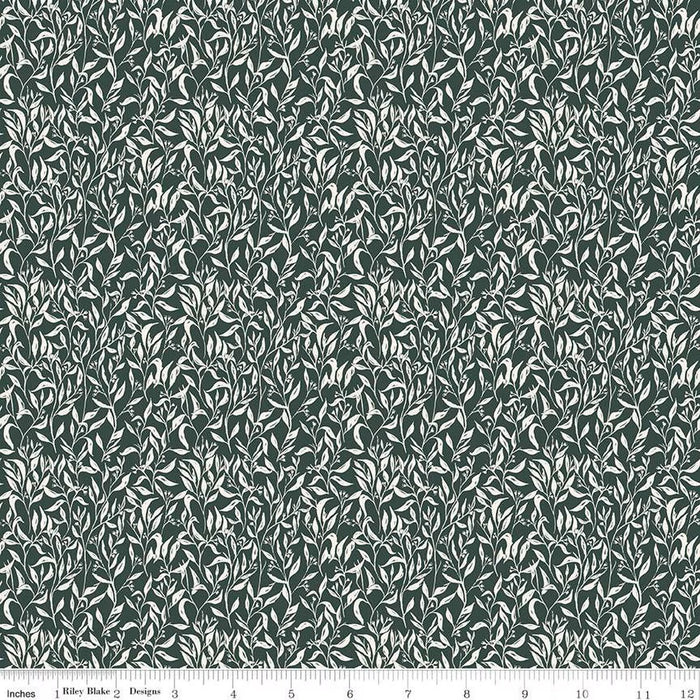 Patterned fabric with small leaf design on a dark green background