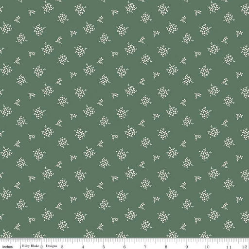 Green fabric with small white floral pattern
