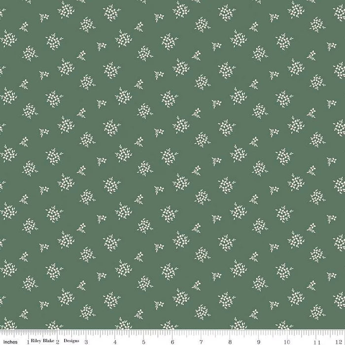 Green fabric with small white floral pattern