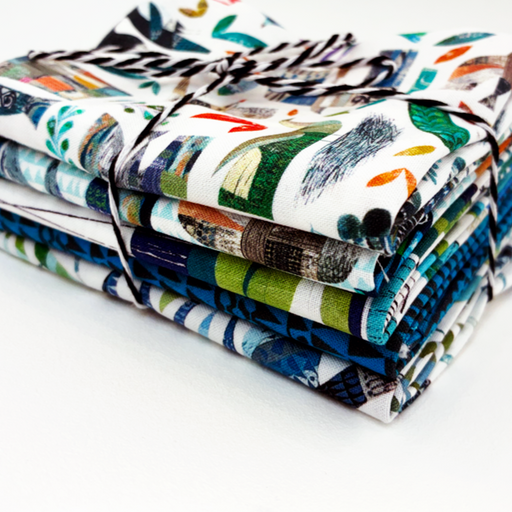 Stack of colorful fabric swatches on a white background