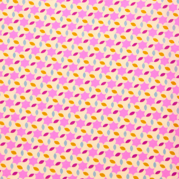 Patterned paper with pink, orange, and blue shapes on a pink background