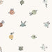 Cream fabric with colourful dots illustrated with animals and vegetables and fruit.
