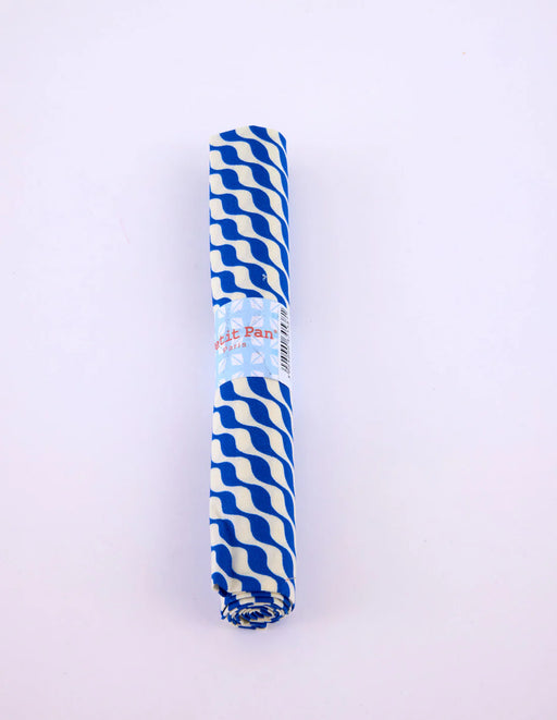 Roll of blue and white striped paper on a light purple background