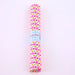 Roll of pink and blue patterned paper with a brand name on a white background