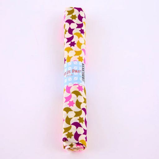 Roll of patterned paper with colorful design on a white background
