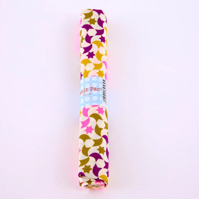 Roll of patterned paper with colorful design on a white background