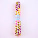 Roll of patterned paper with colorful design on a white background