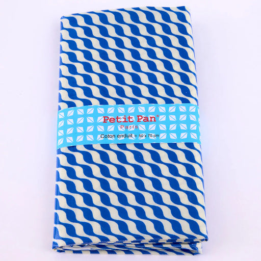 Blue and white striped laminated fabric with 'Petit Pan' branding on a white background