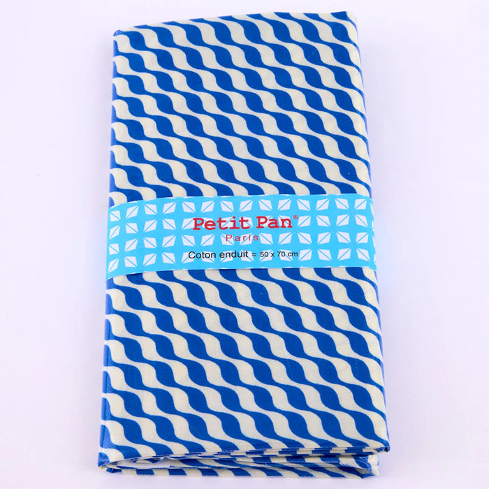 Blue and white striped laminated fabric with 'Petit Pan' branding on a white background