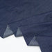 Stack of blue denim fabric on a white background