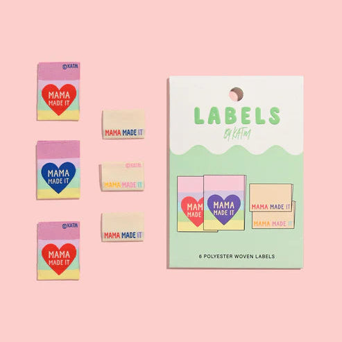 Set of 'Mama Made It' labels on a pink background
