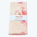 Floral-patterned towel with 'Petit Pan' label on a white background